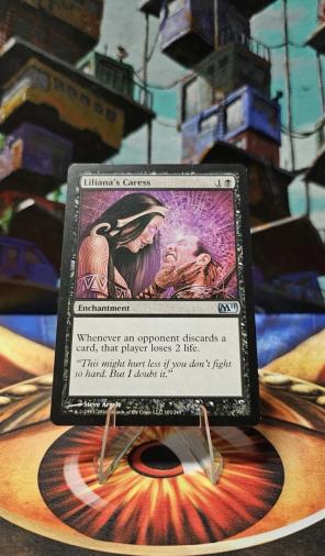 Liliana's Caress - Magic 2011 (M11)LP Nonfoil